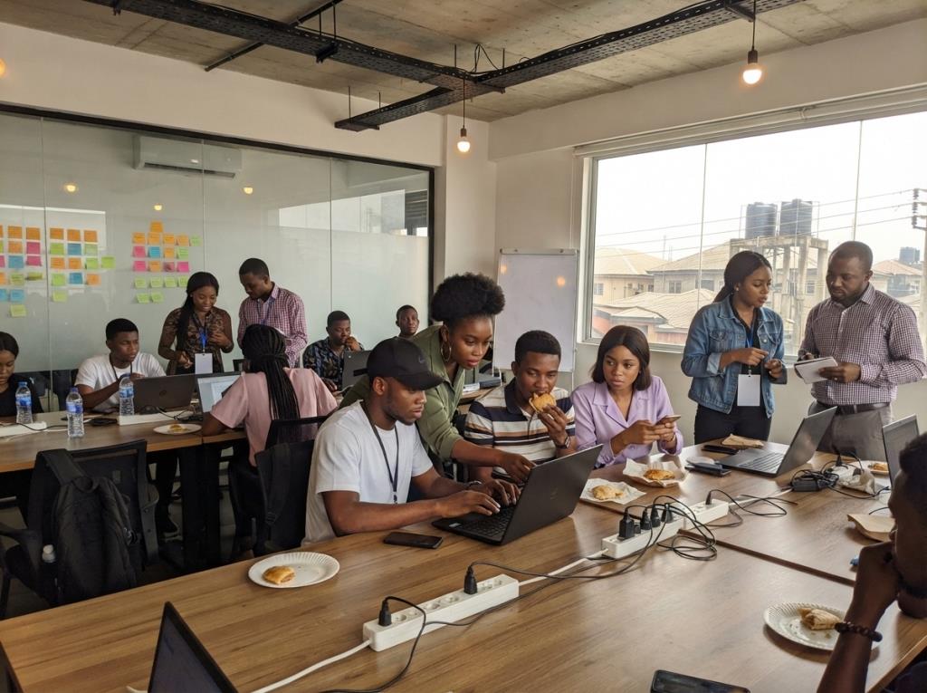 Hackathon participants working in teams in Lagos