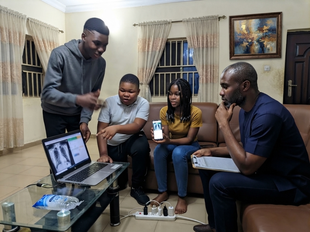 Young team demonstrating a medical imaging app on a laptop